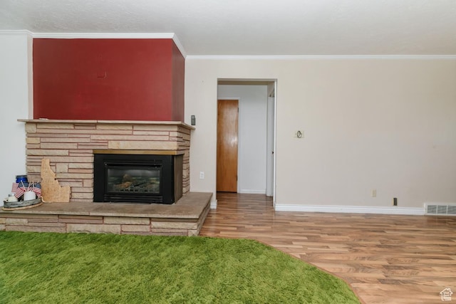 869 N 1600 E, Preston, ID 83263 - unfurnished living room featuring wood finished floors, ornamental molding, and a fireplace
