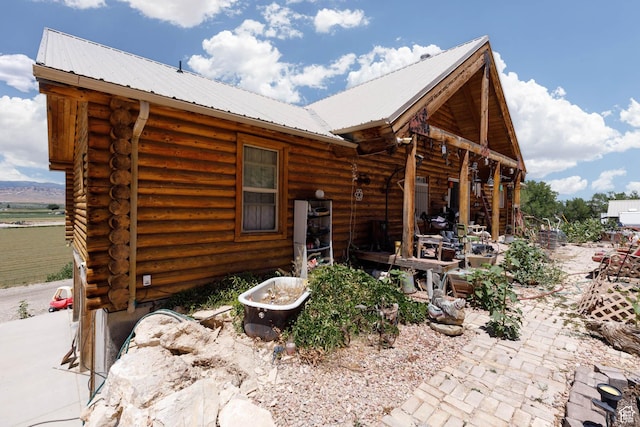 440 N Quarry Rd, Salina, UT 84654 - rear view of house featuring log exterior and a metal roof