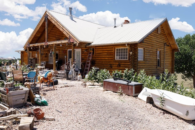 440 N Quarry Rd, Salina, UT 84654 - rear view of property with log siding, a metal roof, and a chimney