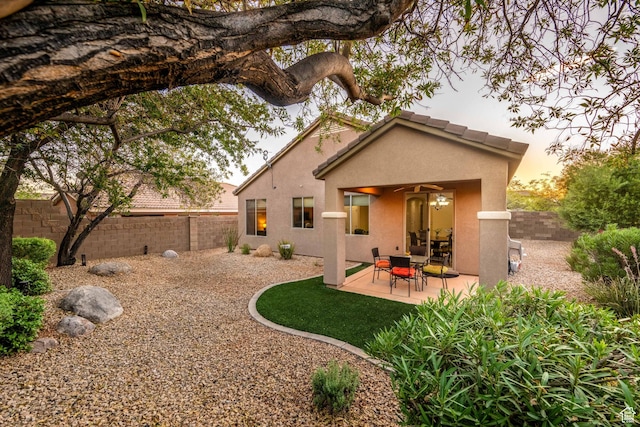1200 N Crown King Ave, Washington, UT 84780 - back of property featuring stucco siding, a patio area, a fenced backyard, and a ceiling fan