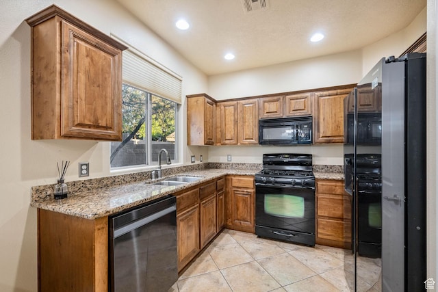 1200 N Crown King Ave, Washington, UT 84780 - kitchen featuring black appliances, brown cabinets, light stone counters, and recessed lighting