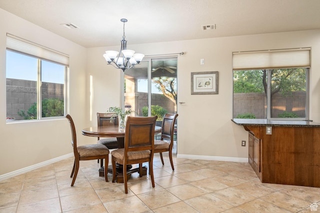 1200 N Crown King Ave, Washington, UT 84780 - dining space featuring a chandelier, healthy amount of natural light, and light tile patterned flooring