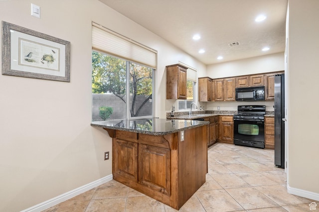 1200 N Crown King Ave, Washington, UT 84780 - kitchen featuring black appliances, a peninsula, brown cabinetry, recessed lighting, and dark stone counters