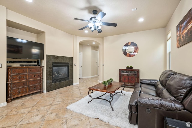 1200 N Crown King Ave, Washington, UT 84780 - living area with arched walkways, ceiling fan, a tile fireplace, and recessed lighting