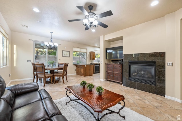 1200 N Crown King Ave, Washington, UT 84780 - living area featuring a chandelier, a tiled fireplace, ceiling fan, recessed lighting, and light tile patterned flooring