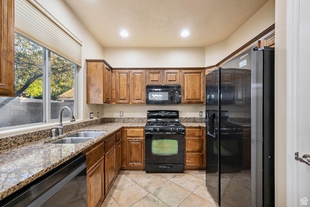 1200 N Crown King Ave, Washington, UT 84780 - kitchen with black appliances, light stone counters, brown cabinets, and recessed lighting