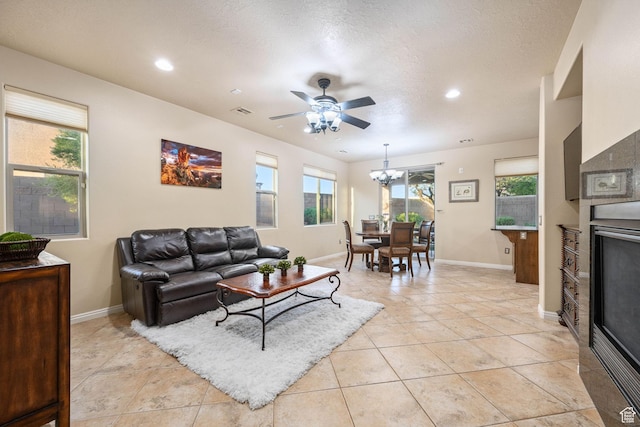1200 N Crown King Ave, Washington, UT 84780 - living room featuring ceiling fan, a chandelier, recessed lighting, light tile patterned floors, and a textured ceiling