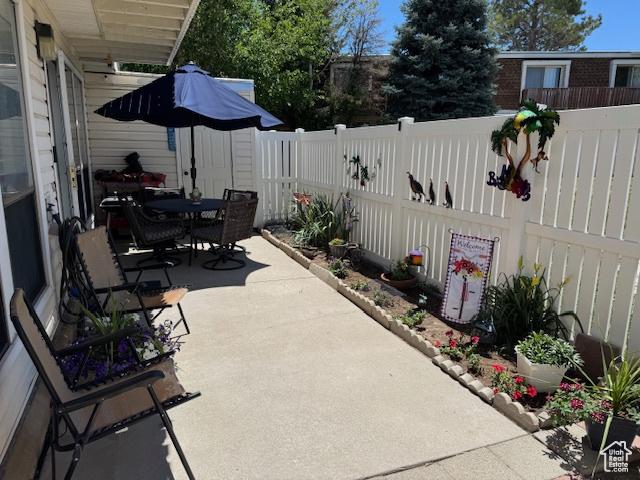 5981 S Sultan Cir, Murray, UT 84107 - fenced backyard with a patio area and outdoor dining space