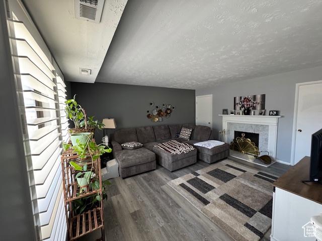 5981 S Sultan Cir, Murray, UT 84107 - living room featuring wood finished floors and a fireplace