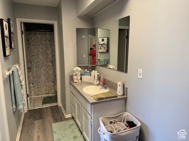 5981 S Sultan Cir, Murray, UT 84107 - full bath with wood finished floors, vanity, and curtained shower