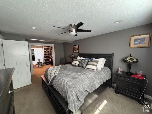 4650 S Chapel Dr E, Salt Lake City, UT 84117 - bedroom featuring light carpet, a textured ceiling, ceiling fan, and recessed lighting