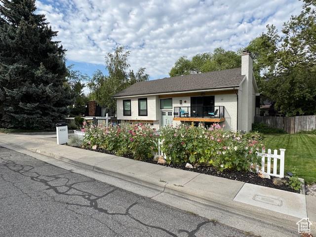4650 S Chapel Dr E, Salt Lake City, UT 84117 - view of front of home with a chimney