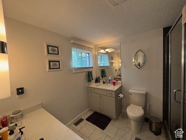 4650 S Chapel Dr E, Salt Lake City, UT 84117 - full bath featuring vanity, a shower stall, a textured ceiling, and tile patterned floors