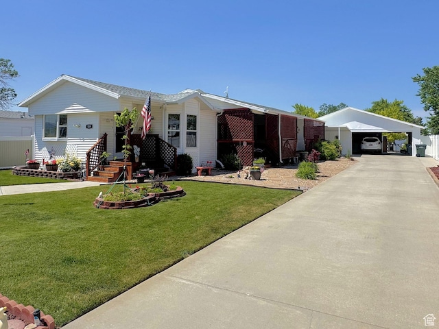 804 Fleetwood Dr, Tooele, UT 84074 - view of front of house with a front yard, driveway, and a carport