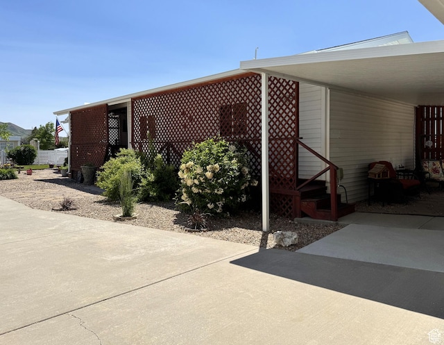 804 Fleetwood Dr, Tooele, UT 84074 - view of patio / terrace featuring an attached carport