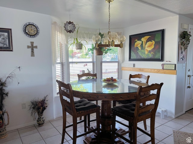804 Fleetwood Dr, Tooele, UT 84074 - dining room with a chandelier and light tile patterned floors