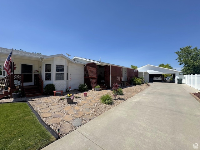 804 Fleetwood Dr, Tooele, UT 84074 - view of front facade featuring concrete driveway and a carport
