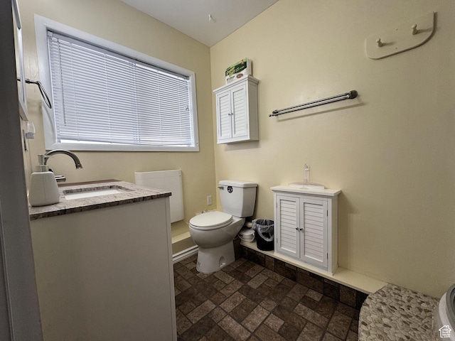 804 Fleetwood Dr, Tooele, UT 84074 - bathroom featuring vanity and brick patterned flooring