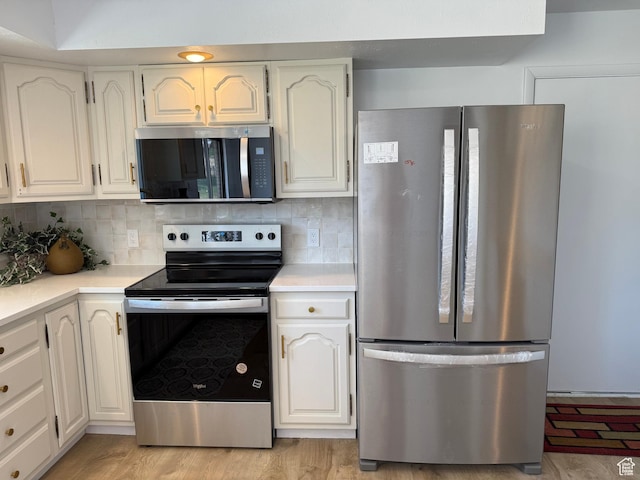 262 N 400 E, Fairview, UT 84629 - kitchen with stainless steel appliances, light countertops, and backsplash