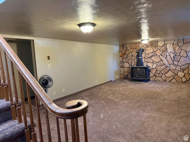 262 N 400 E, Fairview, UT 84629 - unfurnished living room featuring a wood stove, carpet flooring, and stairway