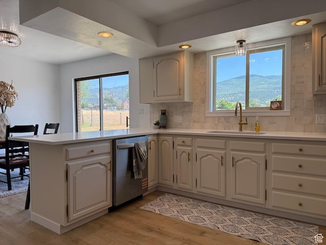 262 N 400 E, Fairview, UT 84629 - kitchen with stainless steel dishwasher, a peninsula, light wood finished floors, light countertops, and recessed lighting