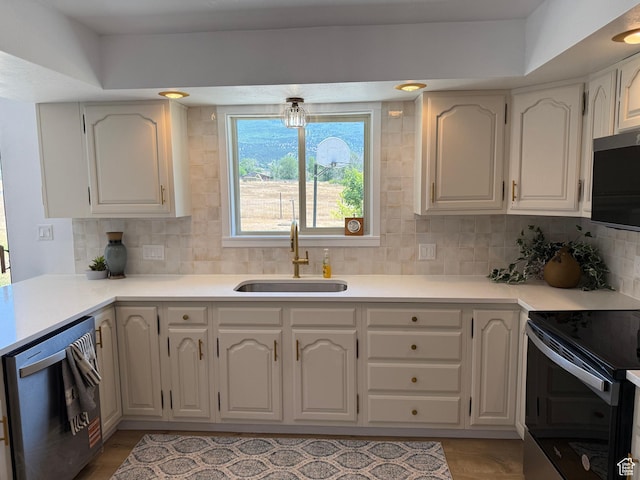 262 N 400 E, Fairview, UT 84629 - kitchen with dishwasher, black electric range, tasteful backsplash, and light countertops