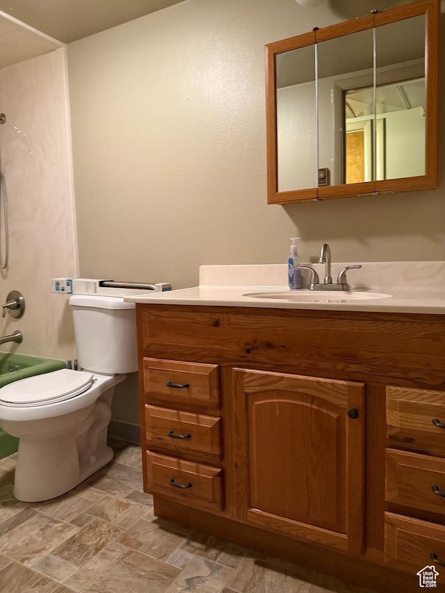 262 N 400 E, Fairview, UT 84629 - bathroom featuring vanity, stone finish floors, and washtub / shower combination