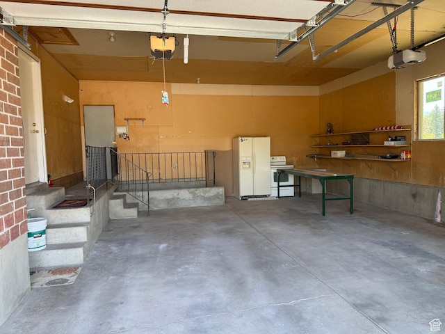 262 N 400 E, Fairview, UT 84629 - garage featuring white fridge with ice dispenser and a garage door opener