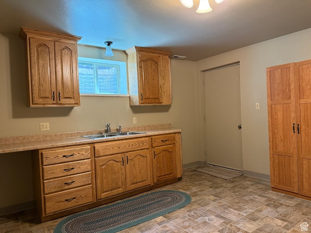 262 N 400 E, Fairview, UT 84629 - kitchen with light countertops, stone finish flooring, and brown cabinets