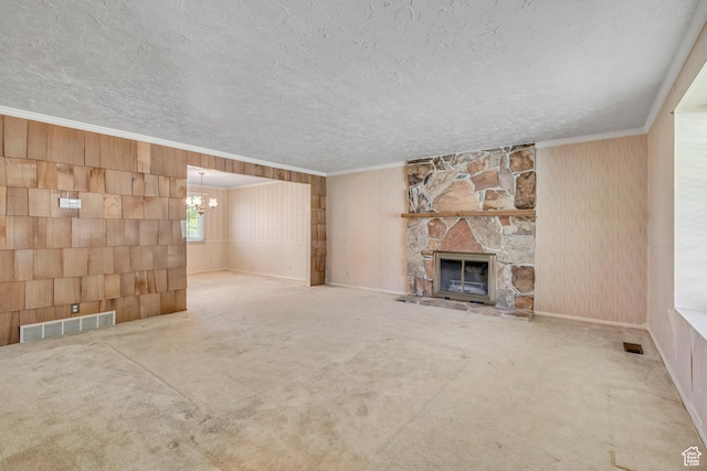 1936 S 800 E, Bountiful, UT 84010 - unfurnished living room featuring a chandelier, wood walls, a textured ceiling, ornamental molding, and a stone fireplace
