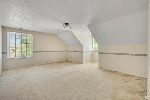 1936 S 800 E, Bountiful, UT 84010 - additional living space with light carpet, a textured ceiling, and lofted ceiling