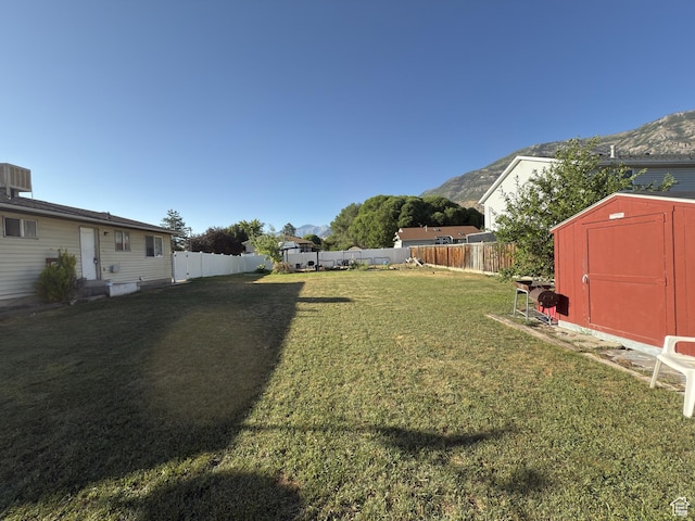 1344 N 280 W, Pleasant Grove, UT 84062 - fenced backyard with a shed and a mountain view