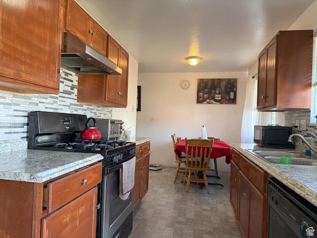 1344 N 280 W, Pleasant Grove, UT 84062 - kitchen with black appliances, under cabinet range hood, tasteful backsplash, light countertops, and brown cabinets