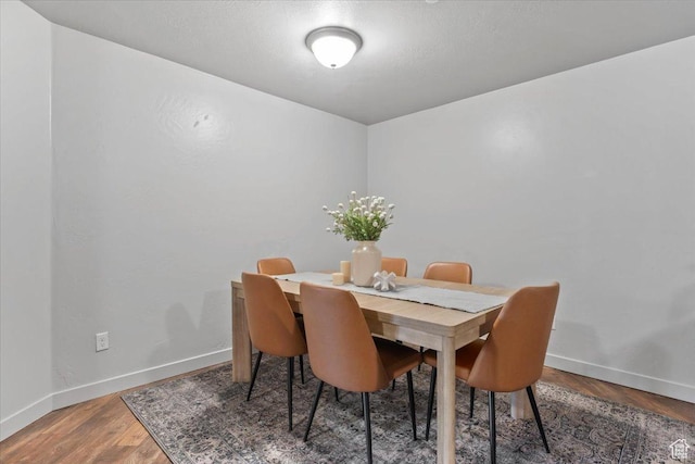 491 S Freedom Blvd Unit 104204, Provo, UT 84601 - dining space featuring baseboards and wood finished floors