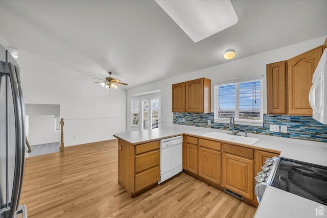 971 N 600 E, Springville, UT 84663 - kitchen with white dishwasher, electric range oven, a ceiling fan, a peninsula, and tasteful backsplash