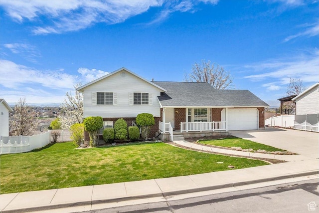 971 N 600 E, Springville, UT 84663 - split level home with brick siding, covered porch, driveway, and an attached garage