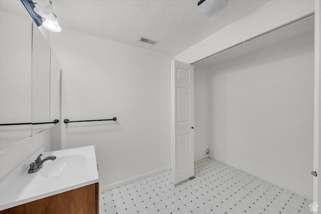 971 N 600 E, Springville, UT 84663 - bathroom with vanity, tile patterned floors, and a textured ceiling