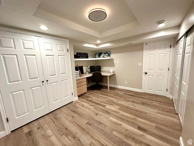 2442 N 2275 E, Layton, UT 84040 - office area featuring light wood-style floors, a tray ceiling, recessed lighting, and built in study area
