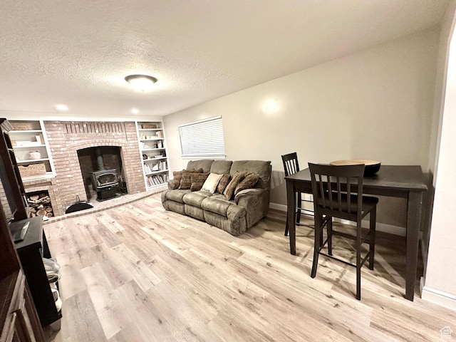 2442 N 2275 E, Layton, UT 84040 - living area with wood finished floors, a textured ceiling, and built in shelves