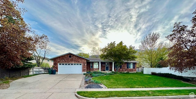 2442 N 2275 E, Layton, UT 84040 - ranch-style home featuring driveway, an attached garage, and brick siding