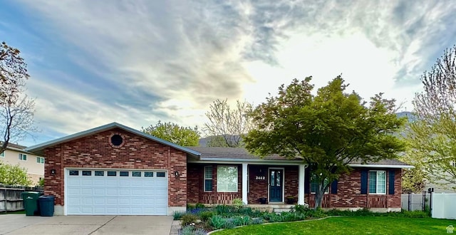 2442 N 2275 E, Layton, UT 84040 - ranch-style home with driveway, brick siding, and an attached garage
