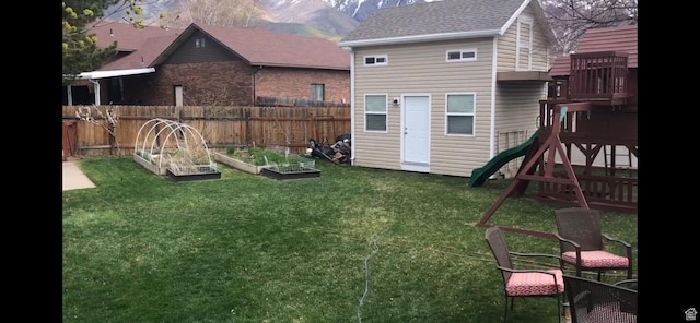 2442 N 2275 E, Layton, UT 84040 - view of yard featuring a vegetable garden, a playground, and a mountain view