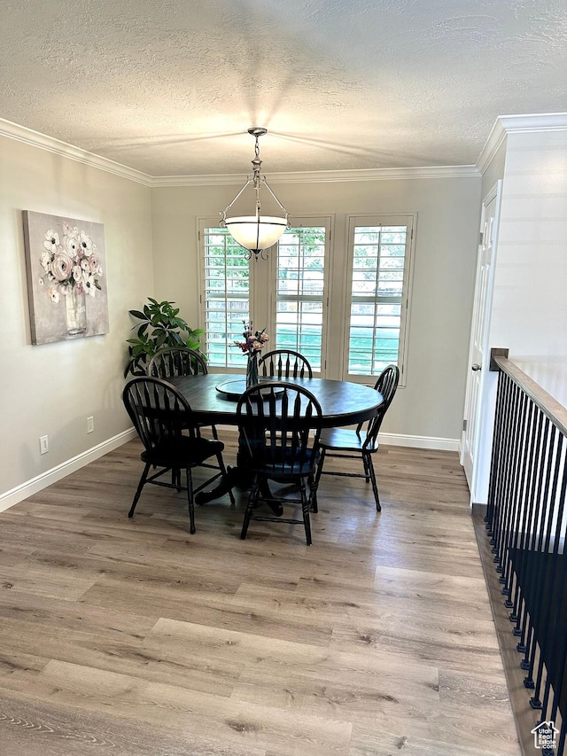 2442 N 2275 E, Layton, UT 84040 - dining room with a textured ceiling, light wood finished floors, and ornamental molding