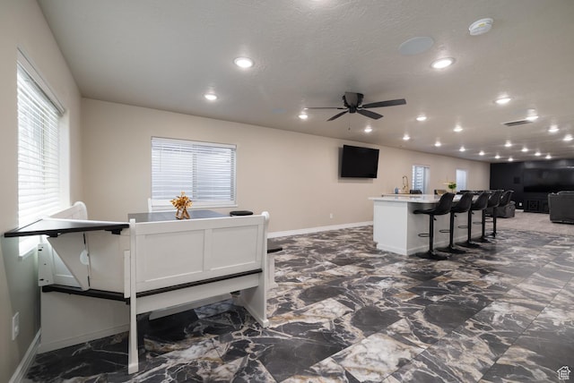 3486 W 1750 S, Vernal, UT 84078 - kitchen with open floor plan, recessed lighting, ceiling fan, a kitchen island with sink, and a breakfast bar area