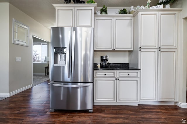 3486 W 1750 S, Vernal, UT 84078 - kitchen with stainless steel fridge with ice dispenser, dark wood finished floors, white cabinetry, and dark stone counters