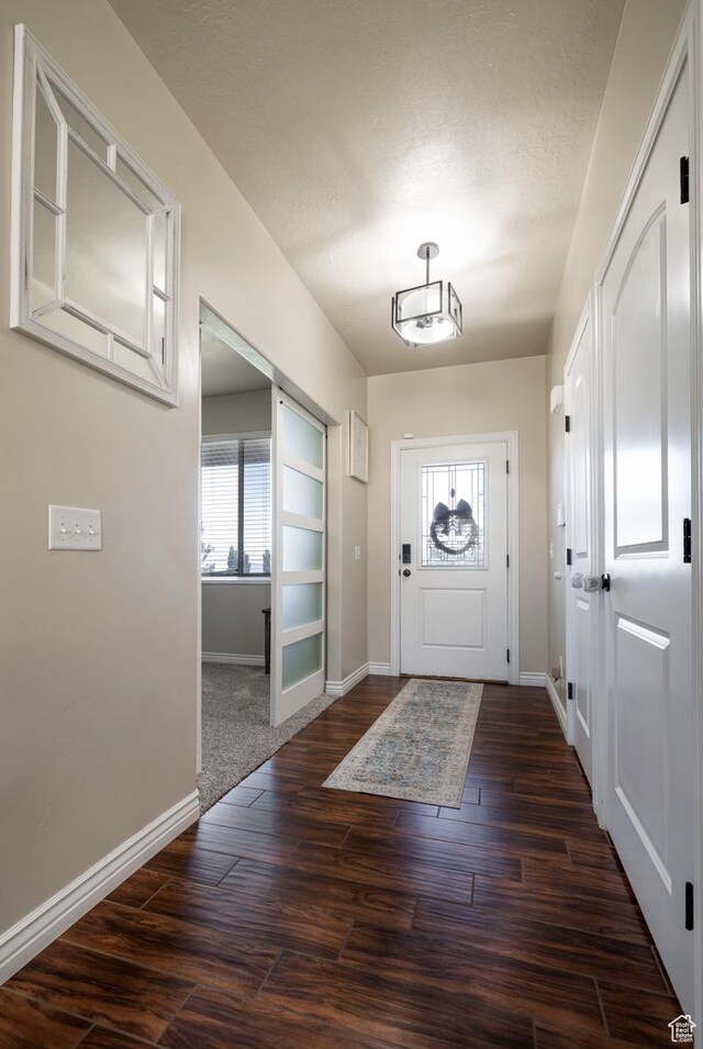 3486 W 1750 S, Vernal, UT 84078 - foyer featuring dark wood-style flooring and a textured ceiling