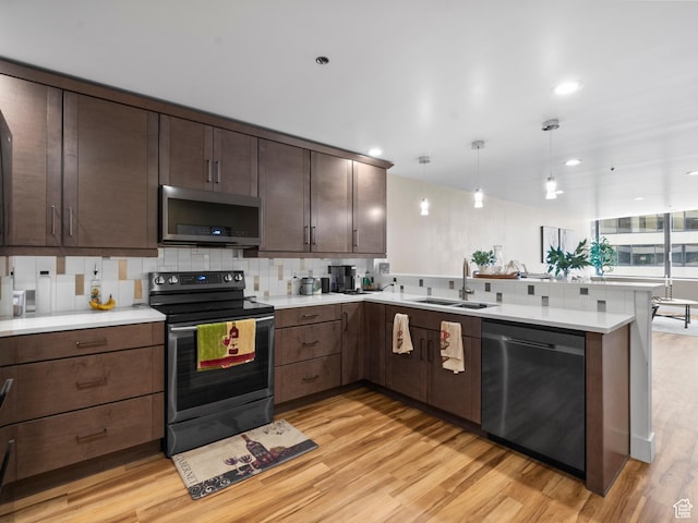 48 W 300 S Unit 1203N, Salt Lake City, UT 84101 - kitchen with stainless steel microwave, electric stove, dishwashing machine, a peninsula, and light wood-style flooring