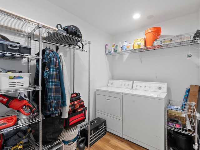 48 W 300 S Unit 1203N, Salt Lake City, UT 84101 - washroom with independent washer and dryer and light wood-style flooring