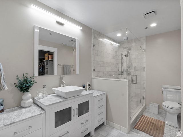 48 W 300 S Unit 1203N, Salt Lake City, UT 84101 - bathroom featuring vanity, a shower stall, marble finish flooring, a walk in closet, and recessed lighting