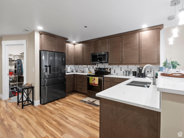 48 W 300 S Unit 1203N, Salt Lake City, UT 84101 - kitchen featuring fridge with ice dispenser, stainless steel microwave, range with electric cooktop, light wood-style flooring, and recessed lighting